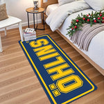 tapis anti dérapant moderne öhlins bleu foncé jaune motif lettres bordure blanche polyester