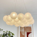 Suspension lumineuse moderne cristal blanc légèrement translucide chaînes métalliques