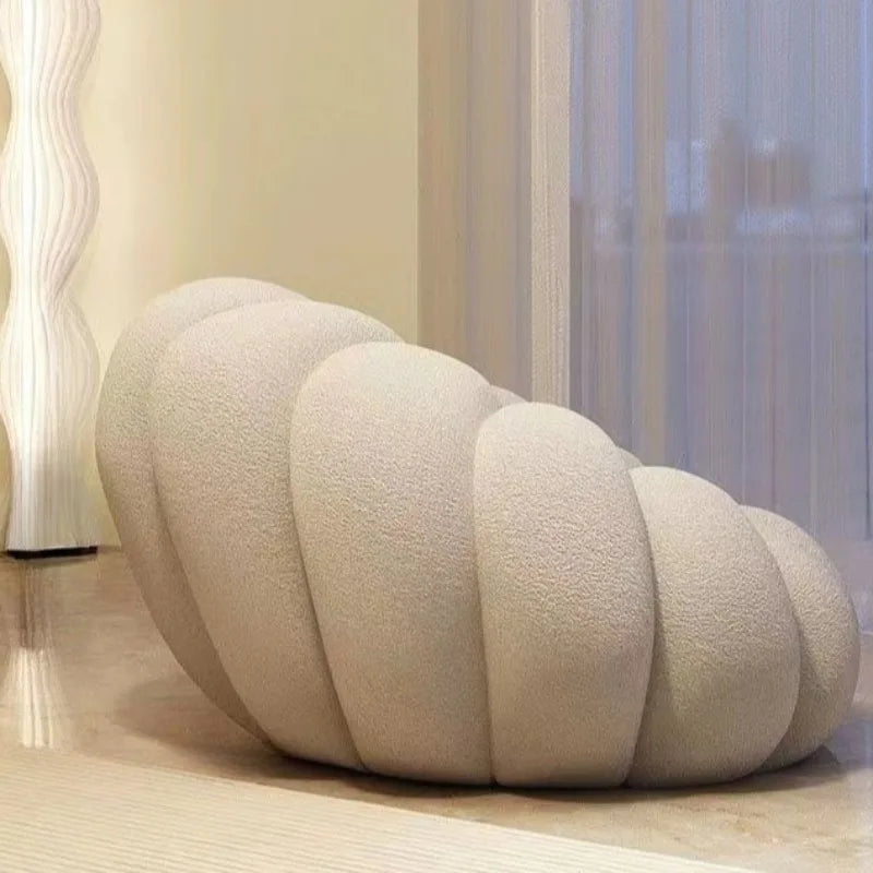 fauteuil moderne velours bouclé doux repos pieds beige clair intérieur meubles salon contemporain