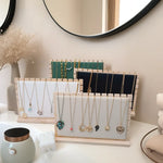 colliers exposants bois velours or argent bleu rose clips modernes minimalistes