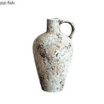 vase poterie moderne gris beige fleur séchée décoration intérieure texture marbrée lisse rustique arrangement