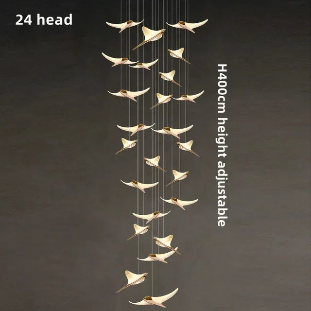 suspension lumineuse or oiseaux stylisés contemporaine minimaliste salon chaînes fixations métal lumière blanche chambre
