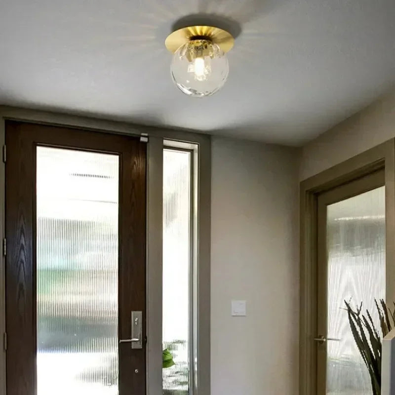 lampe moderne verre transparent noir doré élégante sphérique éclairage contemporain