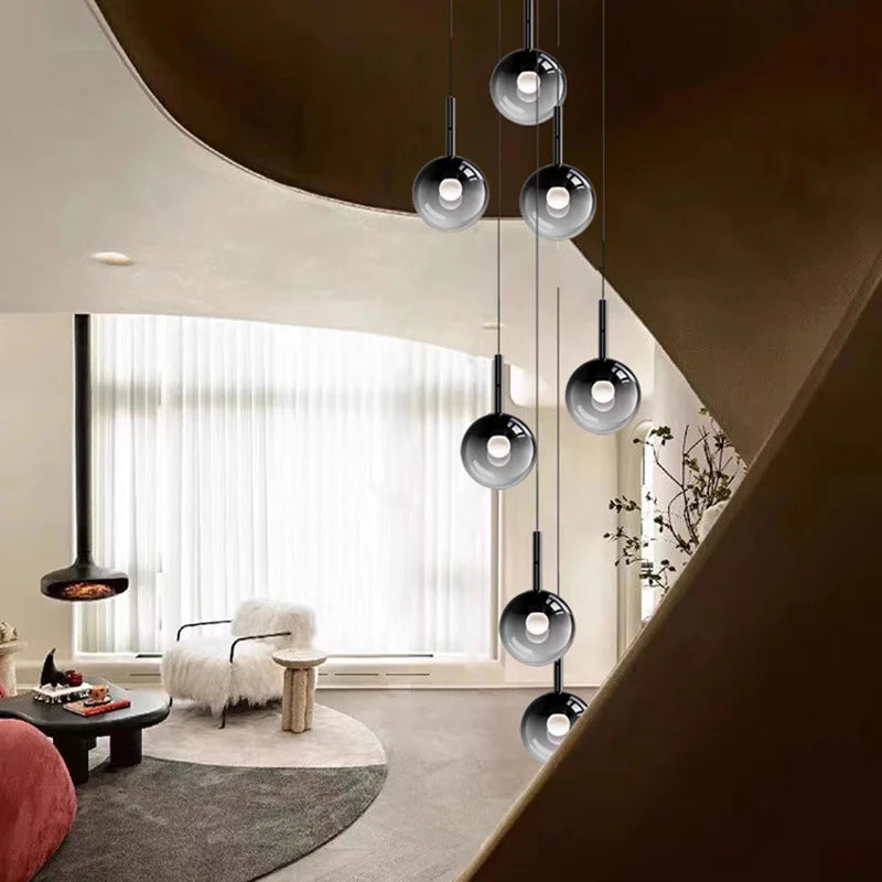 suspension lumineuse moderne minimaliste noir argenté plusieurs têtes éclairage intérieur salon escalier