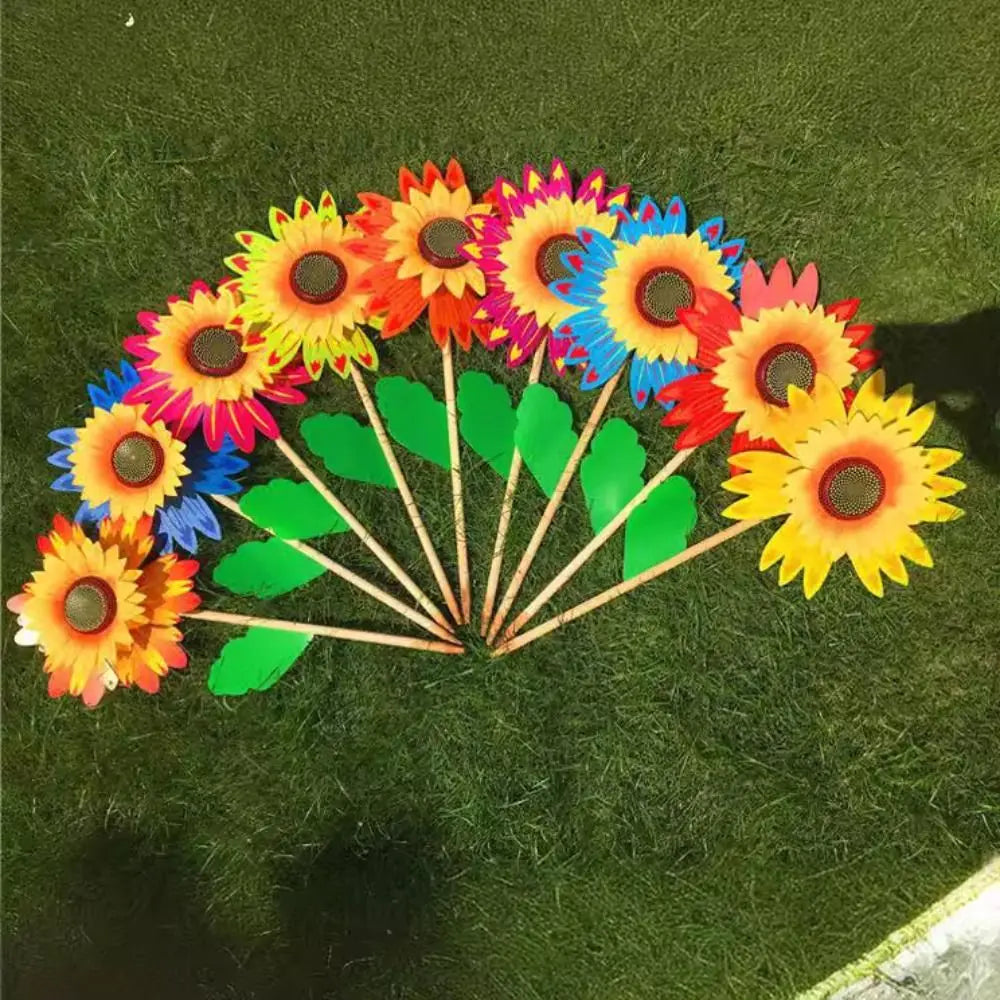 décoration extérieure fleur artificielle jaune rouge bleu vert rayonnante pétale verte tringle jardin cour