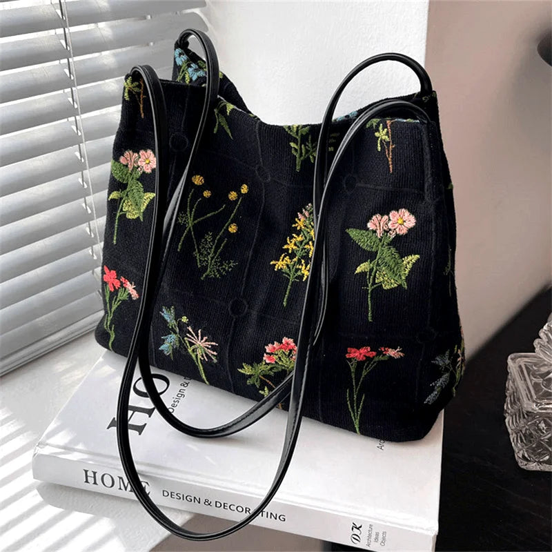 sac main noir broderie fleurs moderne poignées détachables papier stylo bouteille lotion