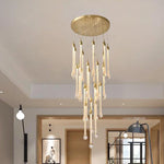 lustre suspension moderne cristal dorées luminaire élégant escalier salon intérieur luxe