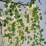guirlande lumineuse artificielle feuilles vertes lumières led blanc decoration intérieure extérieure noël moderne