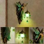 lampe murale mythologique sculptée personnages feuilles verre translucide bronze verte decorative fantastique