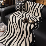 housse canapé molleton jacquard rayures horizontales noir blanc moderne salon intérieur