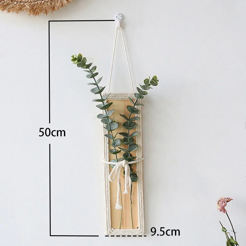 décoration murale kokedama bohème fleurs séchées feuilles vertes bois corde tressée suspension minimaliste chambre