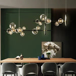 suspension lumineuse moderne noir boules transparentes scandinave chaînes suspendues interrupteur poussoir lumière salon cuisine