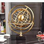 sculpture géométrique moderne sphère dorée anneaux circulaires décoration chambre minimaliste