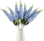 décoration intérieure bouquet artificiel moderne élégant vase livres bougies anniversaire mariage baby shower