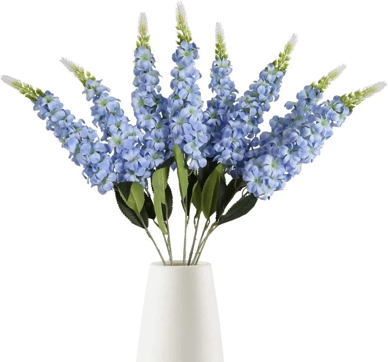 décoration intérieure bouquet artificiel moderne élégant vase livres bougies anniversaire mariage baby shower