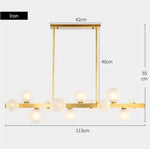 suspension lumineuse moderne or blanc boules translucides chaines interrupteur tactile
