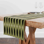 nappe lin géométrique moderne vert olive noir beige assiettes blanches branches feuilles restaurant cuisine