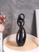 sculpture abstraite moderne couple étreinte résine beige noir gris texture granuleuse salon chambre coucher