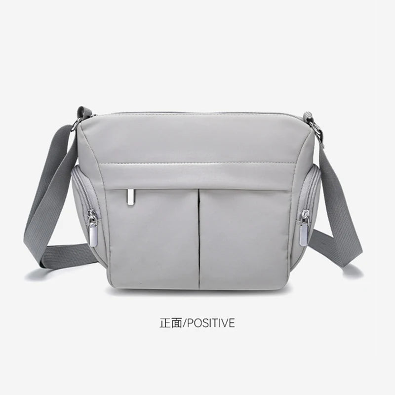 sac bandoulière femme gris clair toile uni moderne ajustable poignée amovible poches ferméreau