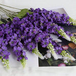 décoration intérieure bouquet artificiel moderne élégant vase livres bougies anniversaire mariage baby shower