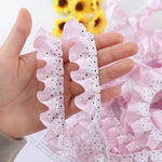 rubans franges dentelles pois noirs rose clair blanc cheveux décoration élégante partie
