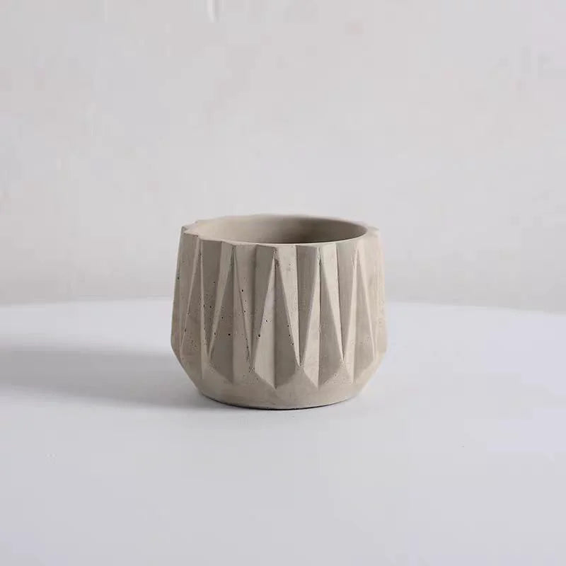 cache coussin géométrique moderne rayures diagonales texture rugueuse gris clair blanc minimaliste
