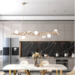 suspension lumineuse moderne doré blanc boules métalliques sphères translucides câble fixé nordique éclairage intérieur