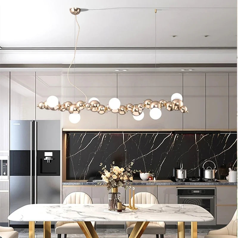 suspension lumineuse moderne doré blanc boules métalliques sphères translucides câble fixé nordique éclairage intérieur