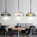 Lampes suspendues modernes transparent doré noir gris abatjour transparent rosace dorée câble suspension LED