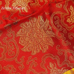 serviette table brodée motifs floraux rouge bleu jaune traditionnel élégant dorure textile décoration table
