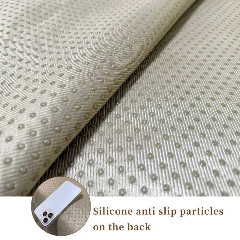 Texture de tissu beige ornée de minuscules points antidérapants en silicone à l'arrière.