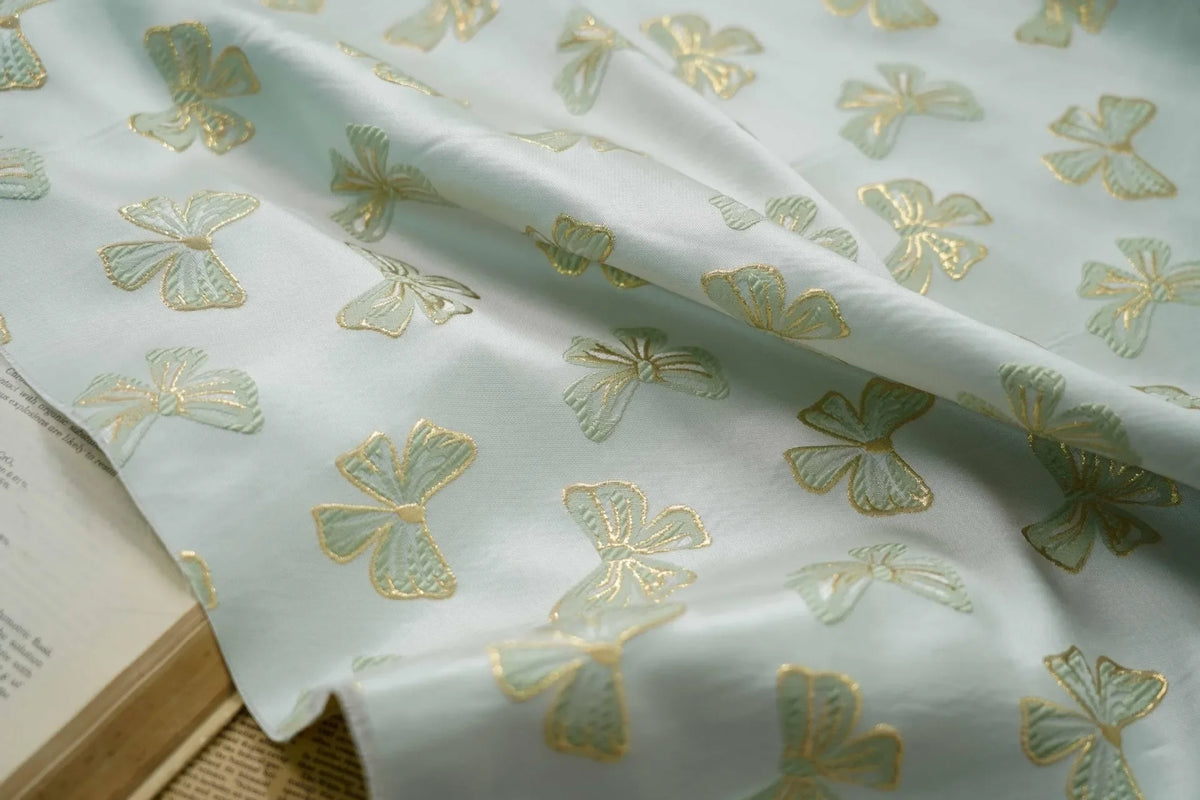 tissu polyester rose clair papillons doré noir moderne élégant coudre bricolage respectueux environnement Jacquard