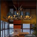 lustre rustique vintage têtes antlers noirs marron clair salon salle manger