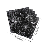assiettes halloween araignées verres serviettes table noire blanc points brillants toile festive octobre