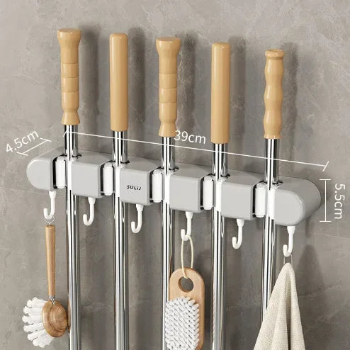 organisateur mural gris outils nettoyage crochets serpillères balais minimaliste autoadhésif