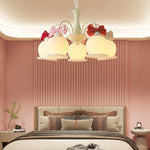 chandelier suspension vert pâle rubans roses abat jour translucides chambre enfant romantique