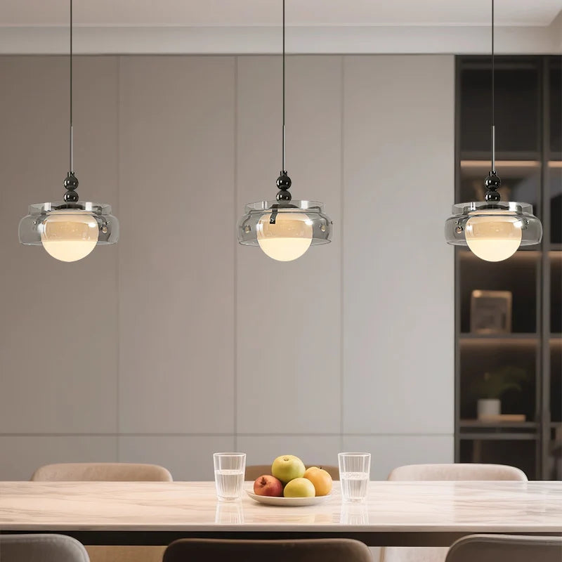 lustre moderne pendentif verre transparent effet fumé lumière blanc chaud salon chambrehôtel