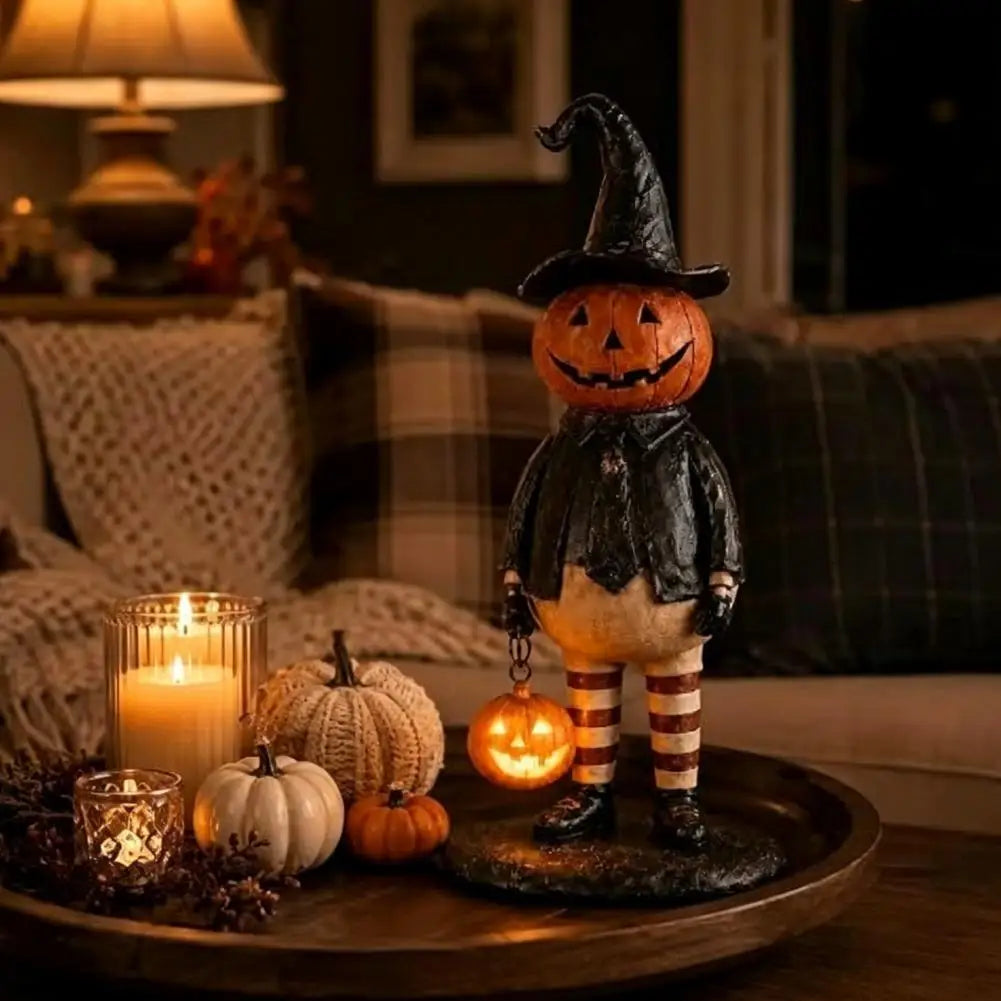 figurine citrouille halloween orange chapeau robe noire bas sculptée décoration intérieure festive