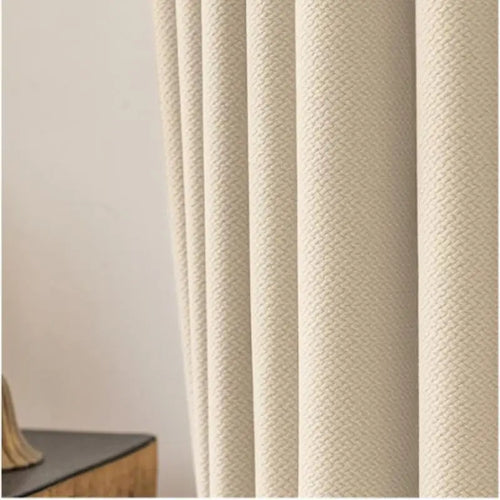 Rideau beige avec motif texturé, idéal pour salon moderne. Aporte une ambiance cosy et élégante à votre intérieur. Parfait pour filtration lumière naturelle et décoration contemporaine.