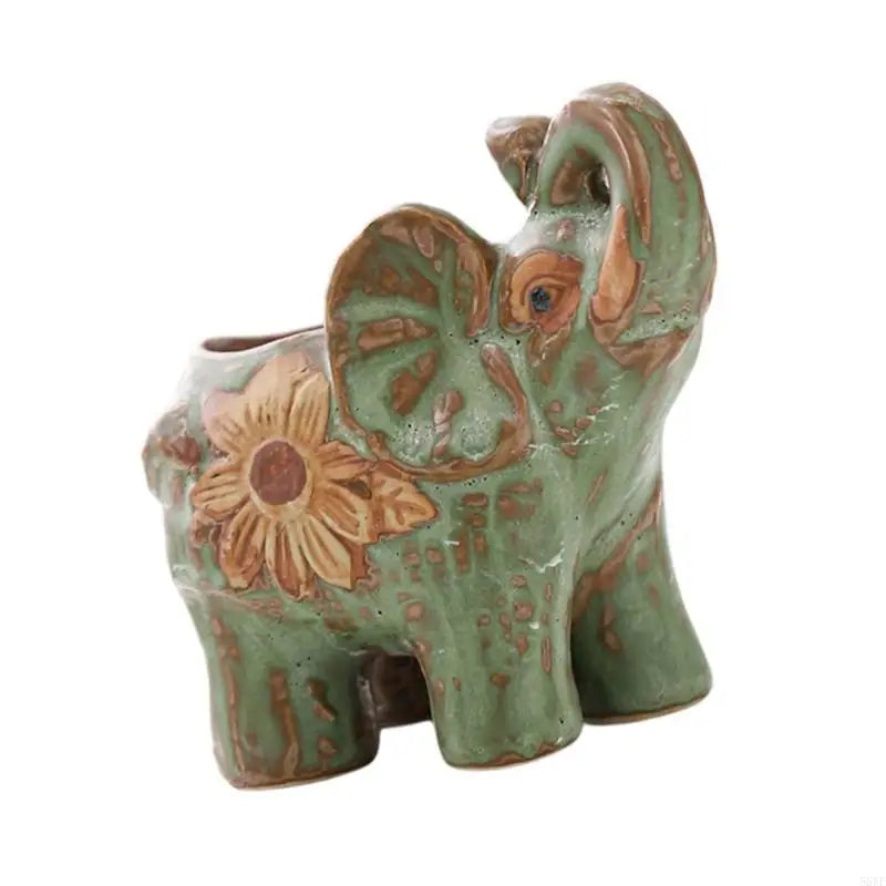statuette éléphant céramique artisanale détaillée trous drainage fleurs jaunes orangées taches brunes opaque
