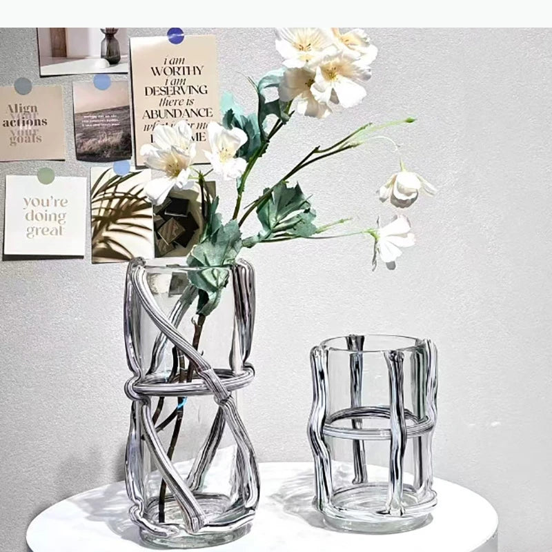 vase moderne transparent tiges entrelacées orange sans fleur