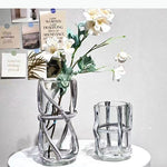 vase moderne transparent tiges entrelacées orange sans fleur