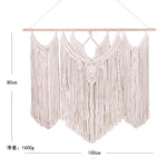 tapisserie macramé boho chic motifs géométriques franges beige clair tige bois crochets métalliques
