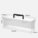 boîte outils transparente poignée jaune contenant vis boulons clous tournevis clé rubans adhésifs pratique