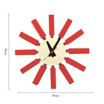 Horloge murale mid century bleu orange noir aiguilles rouge cadran blanc atomique époque