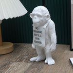 statuette moderne singe résine blanc noir peau texte do nothing vous vivrez plus longtemps