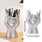 support pinceaux maquillage or argent noir visage stylisé moderne sculpturaliaux pinceaux