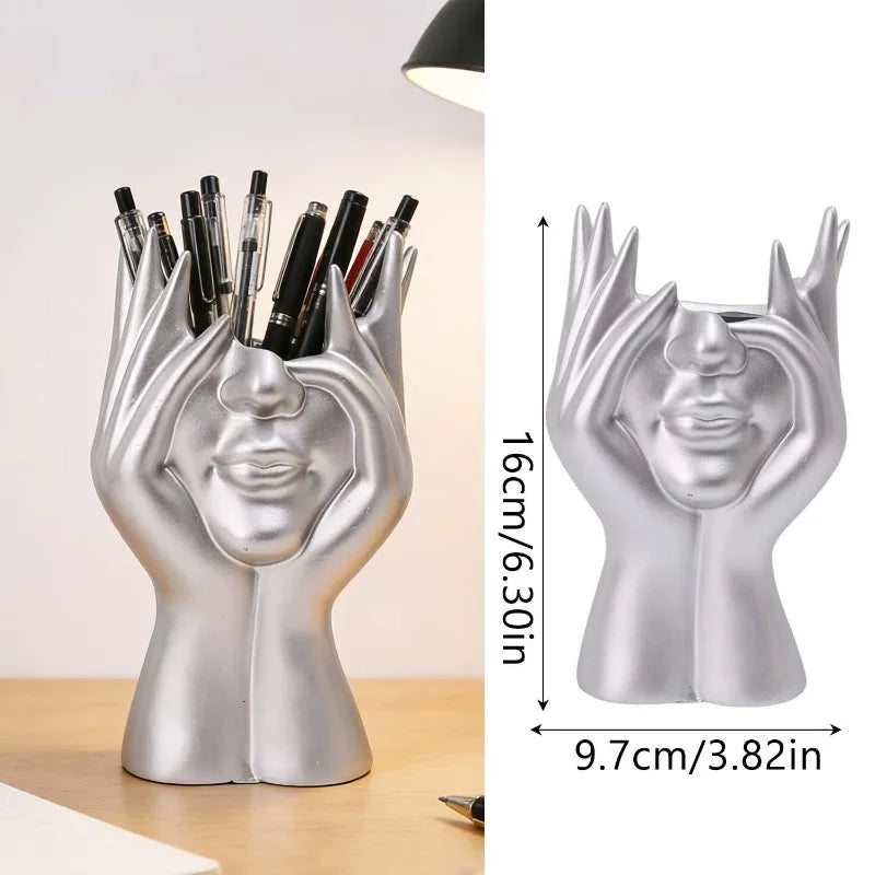 support pinceaux maquillage or argent noir visage stylisé moderne sculpturaliaux pinceaux