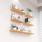 étagères murales noires modernes chambre salon rangement livres plantes cadres vases diffuseurs huiles essentielles
