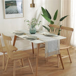 nappe tissée franges scandinave minimaliste gris beige vertebranches verte plante verte pot artwork encadré